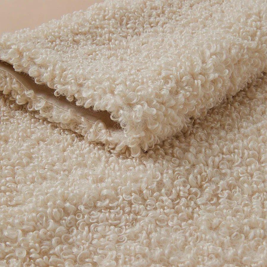 Cream teddy fleece fabric with soft curly pile